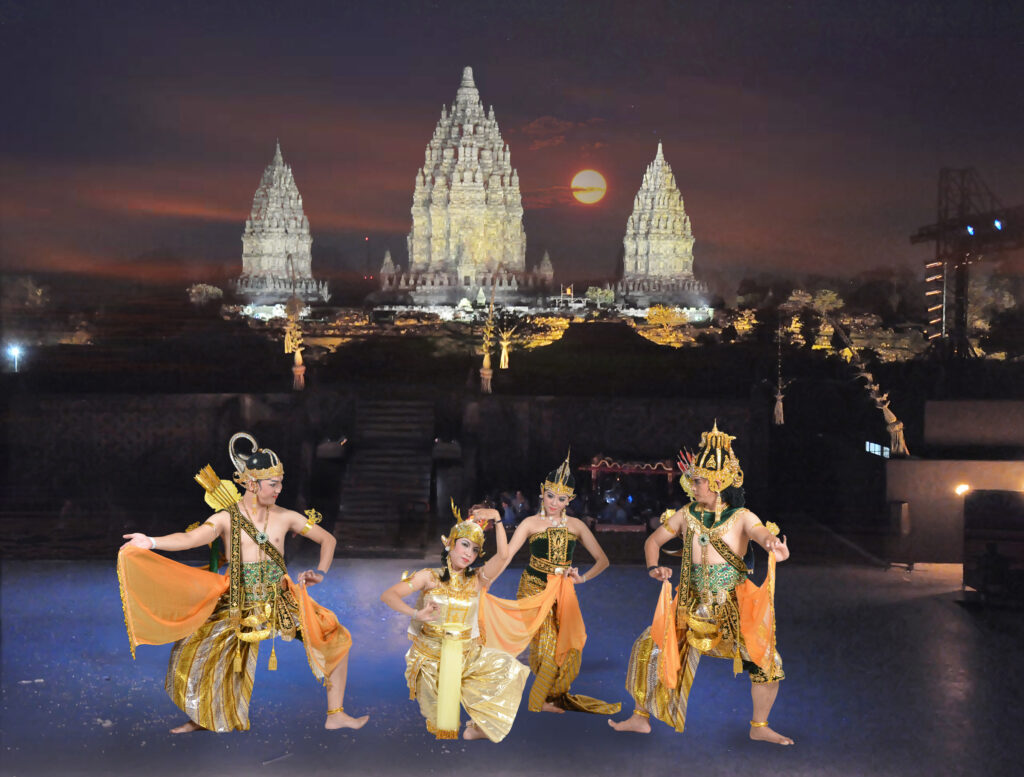 A traditional Ramayana Ballet performance at night with the lit-up spires of Prambanan Temple and a full moon in the background.